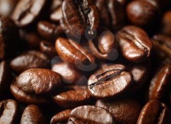 Roasted coffee beans close-up. Shallow depth of field. Selective focus.