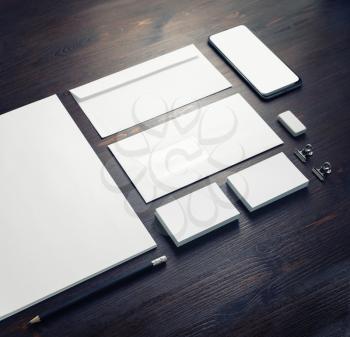 Blank stationery and corporate identity template on wood table background. Responsive design mockup.