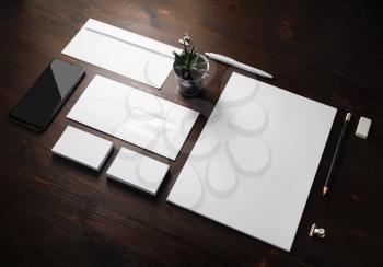 Photo of blank corporate stationery for branding design. Corporate identity set on wooden background.