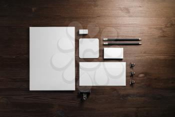 Blank corporate stationery set on wooden background. Branding mock up. Flat lay.