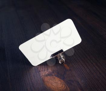 Photo of blank business card on wooden background. Template for ID.