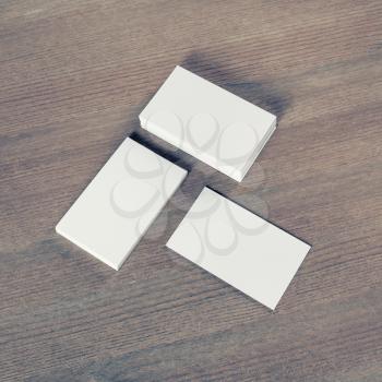 Photo of blank business cards on wood table background. Branding mock up.