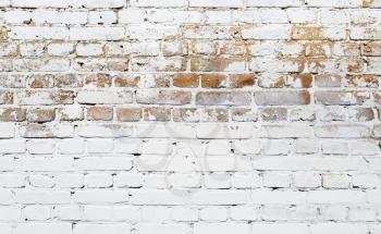 White brick wall texture. Grunge weathered background.