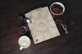 Blank retro stationery and coffee on wood table background. Still life with coffee.