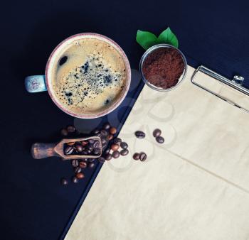 Coffee cup, coffee beans and coffee ground. Fresh delicious coffee. Flat lay.