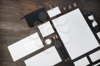 Blank corporate identity template on wooden background. Photo of blank stationery set. Mockup for design presentations and portfolios. Flat lay.