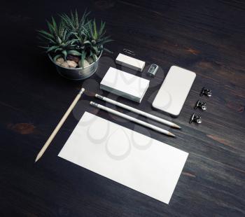 Blank corporate stationery on wood table background. Template for branding identity.