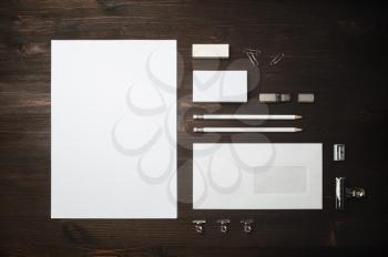Blank branding identity set on wooden background. Stationery template. Top view. Flat lay.