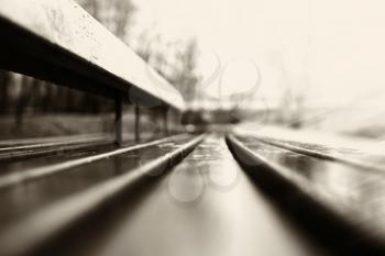 Horizontal sepia bench bokeh background
