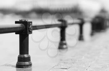 Diagonal black and white fence bokeh background