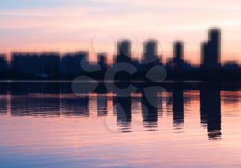 Abstract modern skyscrapers with water reflections background
