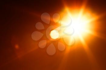 Diagonal orange glowing sun flare background hd