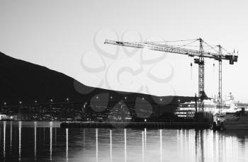 Building cranes in evening Tromso background hd