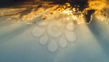 Horizontal vivid vibrant cloudscape with sun rays background backdrop
