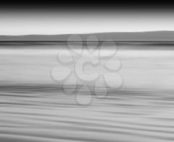 Horizontal black and white ocean milk motion blur abstraction background backdrop