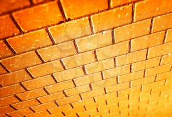 Diagonal orange bricked wall perspective backdrop
