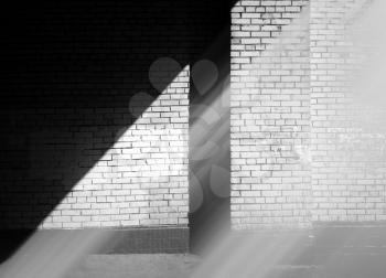 Diagonal beam of light on city wall background