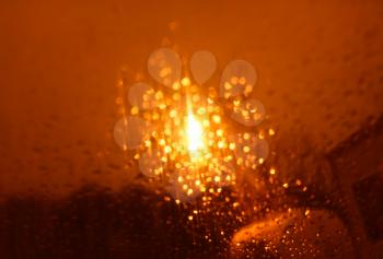 Dramatic orange bokeh from night lamp background
