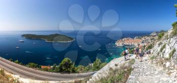 Panoramic view of the Old Town, Lokrum island and Old Port of Dubrovnik, Croatia,  in a sunny summer day