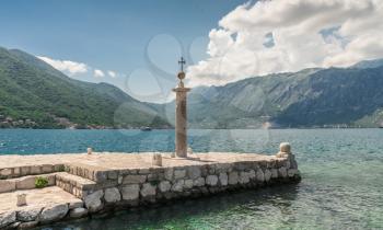 Perast, Montenegro - 07.11.2018.  Pier on the island near the old church in the Bay of Kotor, Montenegro