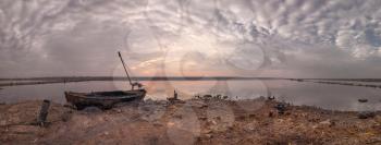Old boat of the mud getters on the salt lake Kuyalnik in Odessa, Ukraine