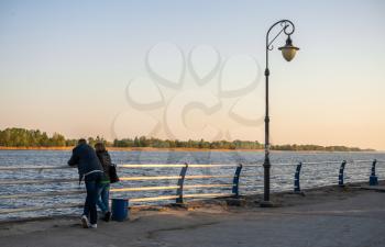 Kherson, Ukraine - 04.27.2019. A couple on the banks of the Dnieper River in Kherson