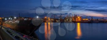 Panoramic view of the sea port and cargo terminal in Odessa, Ukraine, at the summer night