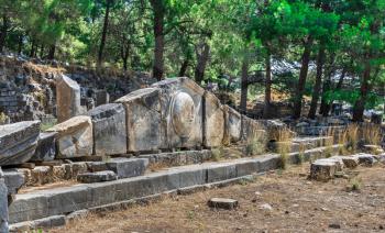 Ruins of the Ancient Theatre in the greek city of Priene in Turkey on a sunny summer day