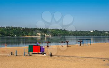 Zaporozhye, Ukraine 07.21.2020. Public beach on the banks of the Dnieper in Zaporozhye, Ukraine, on a sunny summer morning