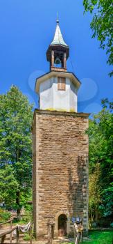 Gabrovo, Etar, Bulgaria - 07.27.2019. Clock tower in the Etar Architectural Ethnographic Complex in Bulgaria on a sunny summer day. Big size panoramic photo.