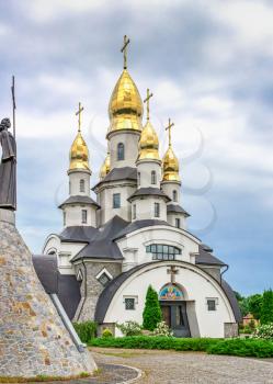 Buki, Ukraine 06.20.2020. Temple Complex with landscape Park in Buki, Ukraine, on a cloudy summer day