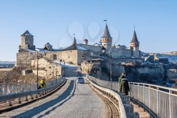 Kamianets-Podilskyi, Ukraine 01.07.2020. Panoramic view of the Castle bridge to Kamianets-Podilskyi fortress on a sunny winter morning