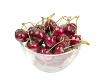 Sweet cherries in glass plate isolated on white background