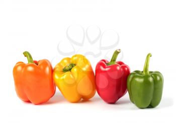 Row of sweet peppers isolated on white background