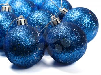 Blue spangled christmas balls isolated on white background