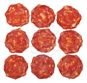 Top view of sliced chorizo sausage isolated on white background