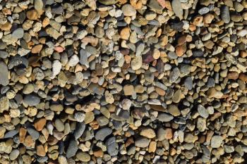 Background from small round crushed stone. A heap from a small pellet.