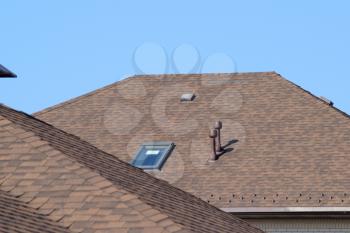 Decorative metal tile on a roof. Types of a roof of roofs.