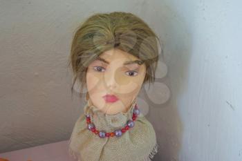 The head of a mannequin on a table. Mannequin for fitting samples of ethnic clothes and hairstyles.