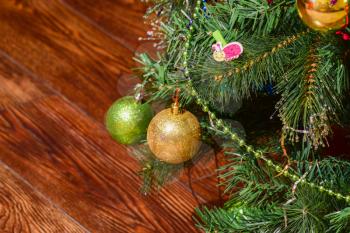 Christmas toys and ornaments on the Christmas tree. Tinsel, balls and toys decorated fir.