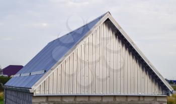 The roof of corrugated sheet. Roofing of metal profile wavy shape.