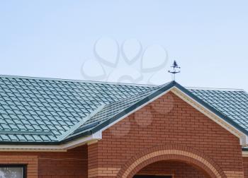 The roof of corrugated sheet. Roofing of metal profile wavy shape.