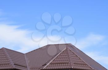 The roof of corrugated sheet. Roofing of metal profile wavy shape.