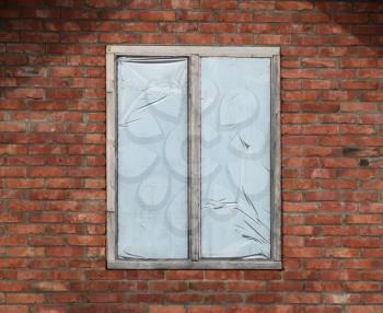 Window in a brick wall. Construction of the house.