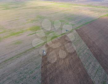 Top view of the tractor that plows the field. disking the soil. Soil cultivation after harvest.