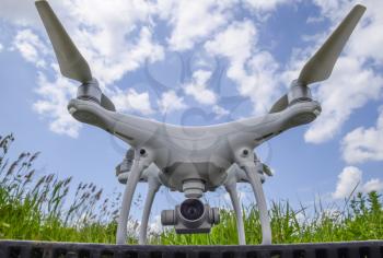 Quadrocopters on a plastic box in the grass. Preparation quadrocopter to fly.