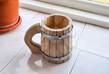 Decorative cup shaped drums. Wooden mug of beer.