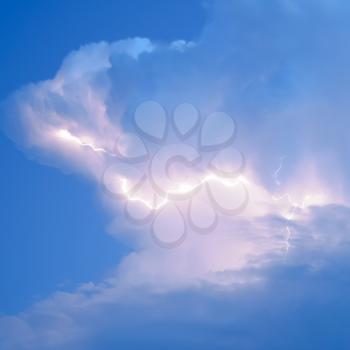 Lightnings in storm clouds. Peals of a thunder and the sparkling lightnings in clouds.