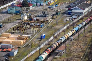 Freight train traveling through the city buildings