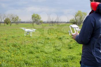 A man with a remote control in his hands. Flight control of the drone. Phantom.